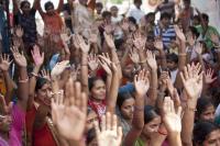 People with arms raised