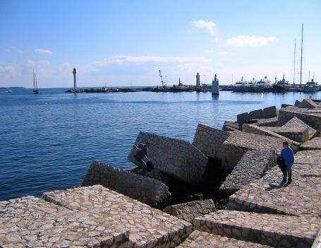 While many coasts are lined with artificial breakwaters, restoring coastal wetlands would also protect shores at a significantly lower cost. Photo credit to Mikko Lahti/Flickr