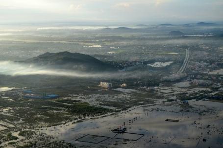 Flooding on edge of city with mountains