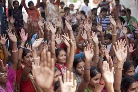 People with arms raised