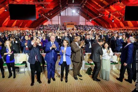 People standing and clapping